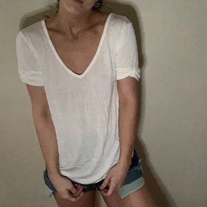 White vneck with rolled sleeves